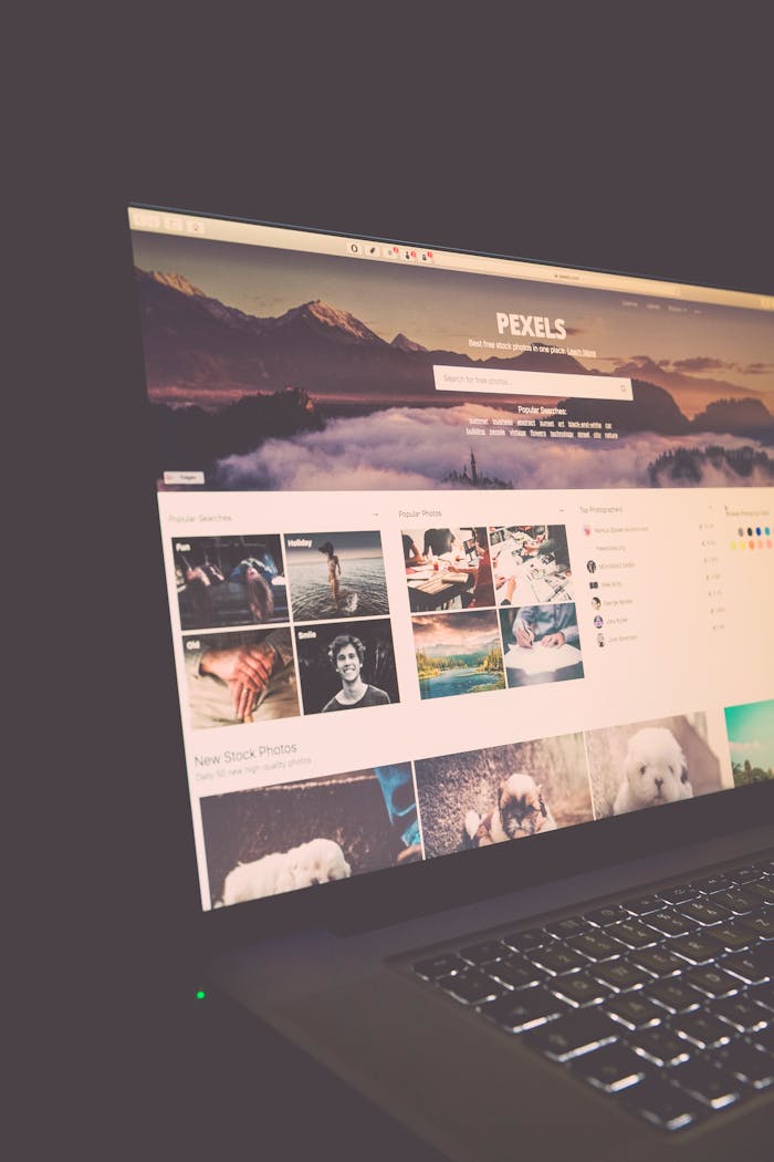 Home Laptop screen showing Pexels website, ideal for stock photo needs.